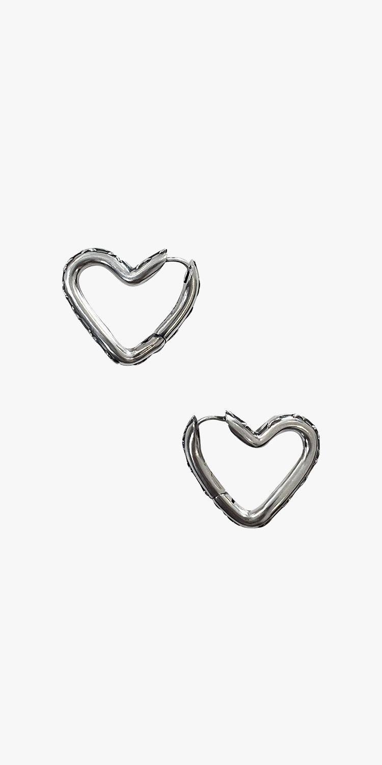 Inclined heart silver earrings